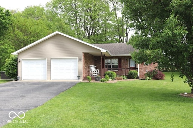 7 Gladiator Dr, Waynetown, IN 47990 - single story home featuring a porch, brick siding, driveway, a front lawn, and a garage