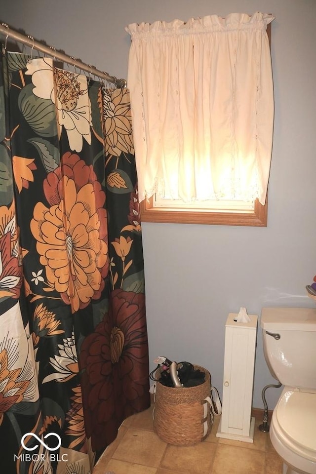 7 Gladiator Dr, Waynetown, IN 47990 - bathroom featuring tile patterned floors, toilet, and curtained shower