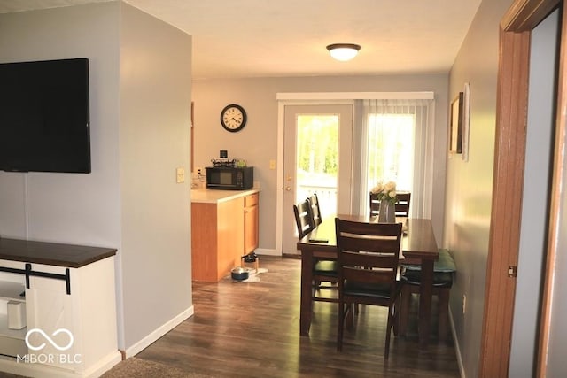7 Gladiator Dr, Waynetown, IN 47990 - dining room featuring dark wood-type flooring and baseboards
