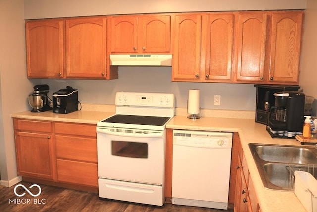 7 Gladiator Dr, Waynetown, IN 47990 - kitchen featuring under cabinet range hood, white appliances, light countertops, a sink, and dark wood-type flooring