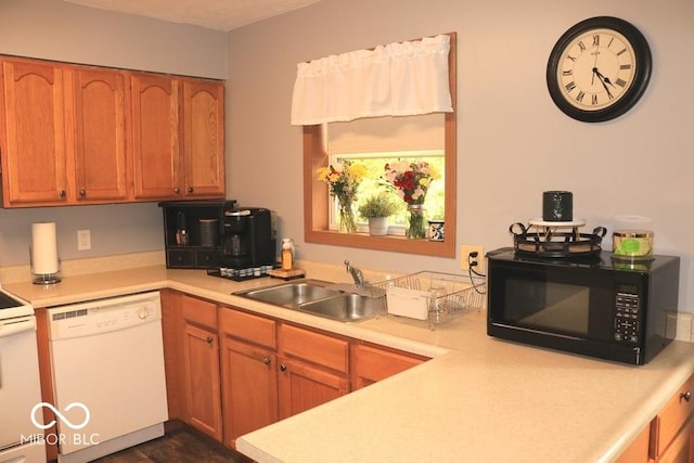 7 Gladiator Dr, Waynetown, IN 47990 - kitchen featuring white appliances, light countertops, and a sink