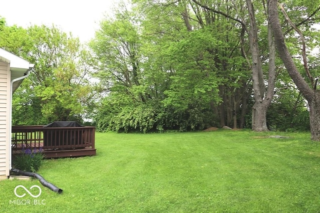 7 Gladiator Dr, Waynetown, IN 47990 - view of green lawn with a wooden deck