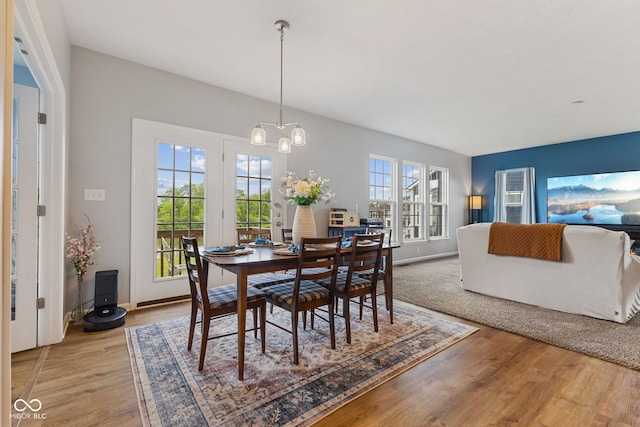 3948 Saddle Club S Parkway, Bargersville, IN 46106 - dining area featuring light wood finished floors, a chandelier, and baseboards