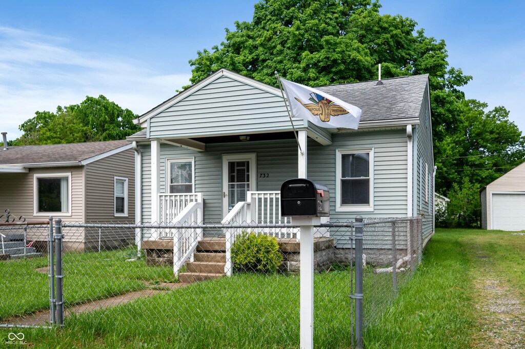 732 S Biltmore Ave, Indianapolis, IN 46241 - view of front of house featuring a shingled roof and covered porch