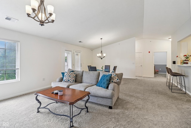 8910 Hunters Creek Dr Unit 207, Indianapolis, IN 46227 - living area with a chandelier, lofted ceiling, plenty of natural light, and carpet