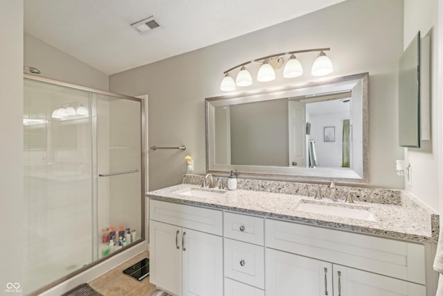 8910 Hunters Creek Dr Unit 207, Indianapolis, IN 46227 - full bath with a shower stall and double vanity
