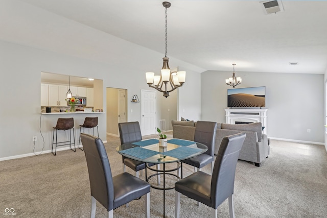 8910 Hunters Creek Dr Unit 207, Indianapolis, IN 46227 - dining space featuring a chandelier, lofted ceiling, light colored carpet, baseboards, and a fireplace