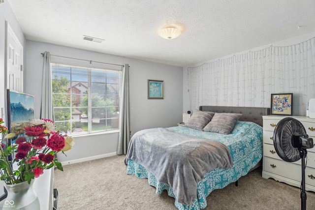 8910 Hunters Creek Dr Unit 207, Indianapolis, IN 46227 - carpeted bedroom featuring a textured ceiling and baseboards