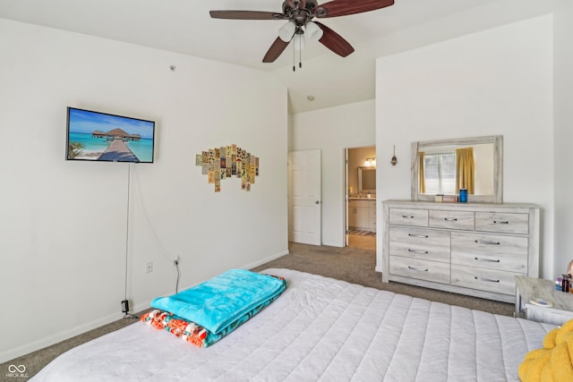 8910 Hunters Creek Dr Unit 207, Indianapolis, IN 46227 - bedroom featuring lofted ceiling, carpet floors, baseboards, a ceiling fan, and connected bathroom