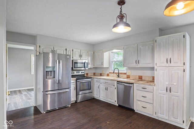 522 E County Road 1000 S, Clayton, IN 46118 - kitchen with appliances with stainless steel finishes, dark wood-style flooring, a sink, and white cabinetry