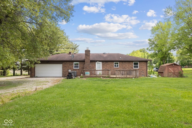 522 E County Road 1000 S, Clayton, IN 46118 - rear view of property featuring a storage unit, driveway, a lawn, a chimney, and brick siding