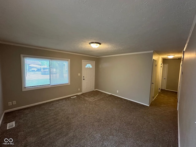 3742 N Wittfield St, Indianapolis, IN 46235 - foyer entrance with a textured ceiling, ornamental molding, dark colored carpet, and baseboards
