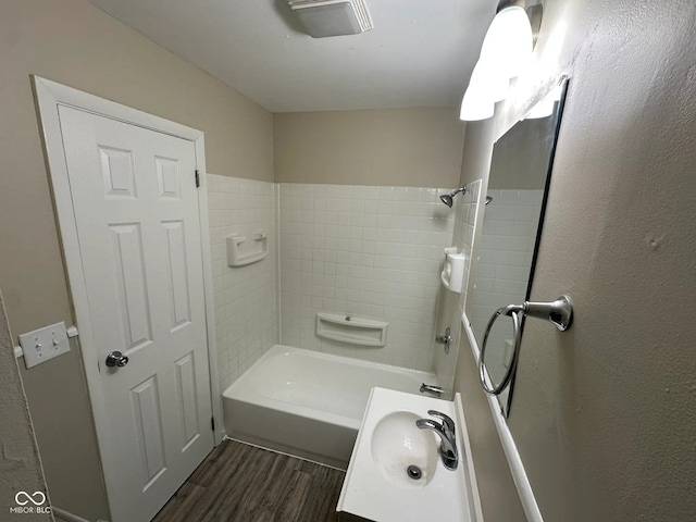 3742 N Wittfield St, Indianapolis, IN 46235 - bathroom with a sink, wood finished floors, and shower / bathtub combination
