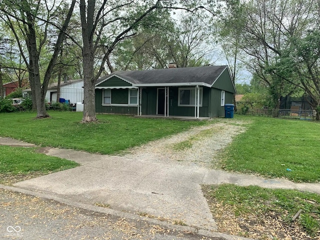 3742 N Wittfield St, Indianapolis, IN 46235 - view of front of home with a chimney, gravel driveway, and a front yard