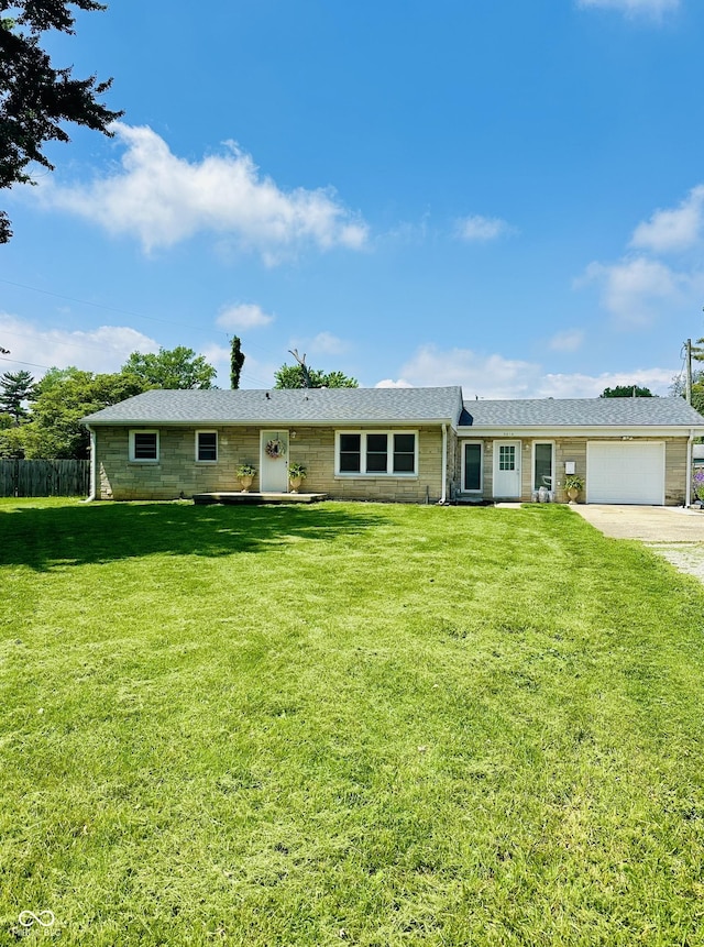 3414 Rost Dr, Columbus, IN 47203 - ranch-style home featuring an attached garage and driveway