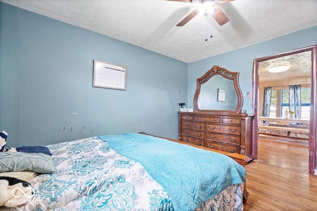 671 W 350 N, Shelbyville, IN 46176 - bedroom featuring a textured ceiling, wood finished floors, and ceiling fan