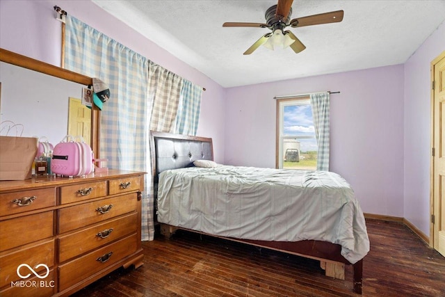 671 W 350 N, Shelbyville, IN 46176 - bedroom with dark wood-style floors, baseboards, ceiling fan, and a textured ceiling