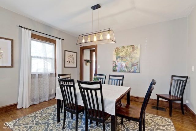 344 N Whittier Pl, Indianapolis, IN 46219 - dining area with wood finished floors and baseboards