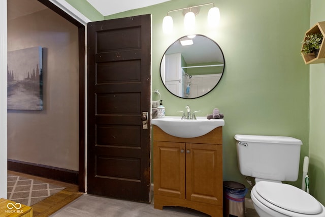 344 N Whittier Pl, Indianapolis, IN 46219 - bathroom featuring vanity, toilet, curtained shower, and wood finished floors