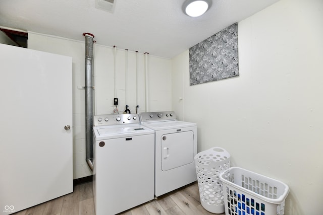 1310 Kings Cove Ct, Indianapolis, IN 46260 - laundry area featuring separate washer and dryer and light wood-style floors