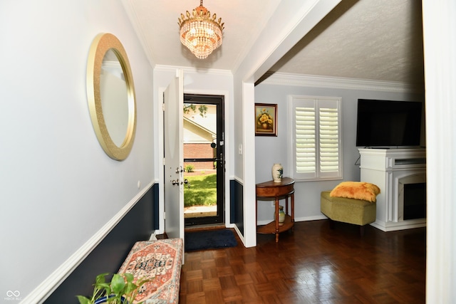 1310 Kings Cove Ct, Indianapolis, IN 46260 - entryway with a chandelier, ornamental molding, baseboards, and a fireplace