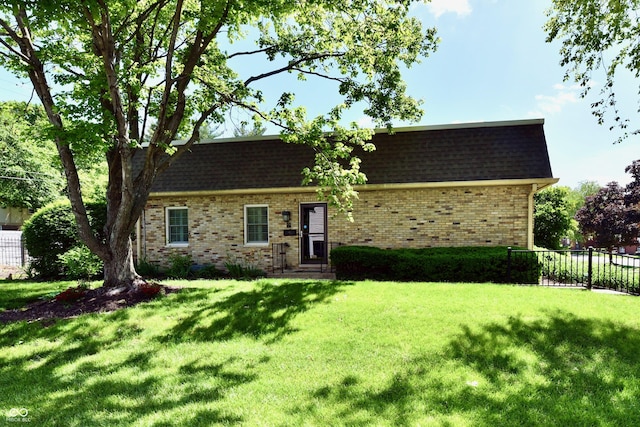 1310 Kings Cove Ct, Indianapolis, IN 46260 - view of front facade featuring brick siding and roof with shingles