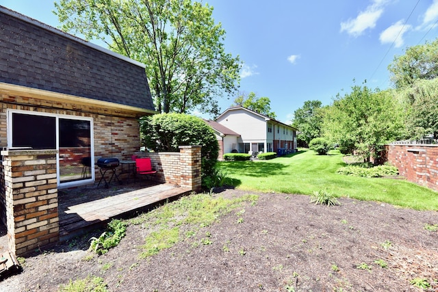 1310 Kings Cove Ct, Indianapolis, IN 46260 - view of grassy yard with a wooden deck