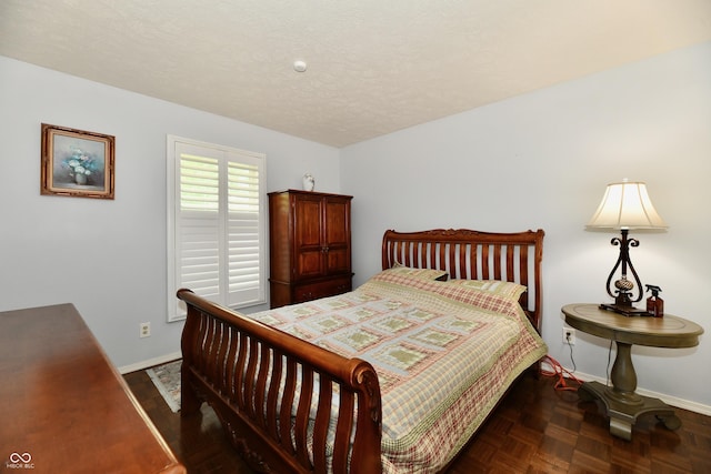 1310 Kings Cove Ct, Indianapolis, IN 46260 - bedroom featuring baseboards and a textured ceiling