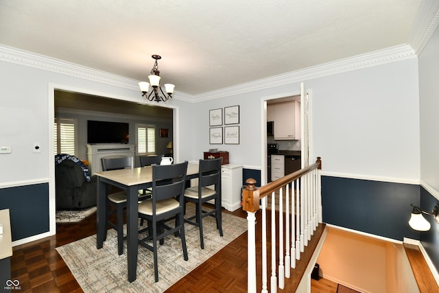 1310 Kings Cove Ct, Indianapolis, IN 46260 - dining space with a chandelier, ornamental molding, and baseboards