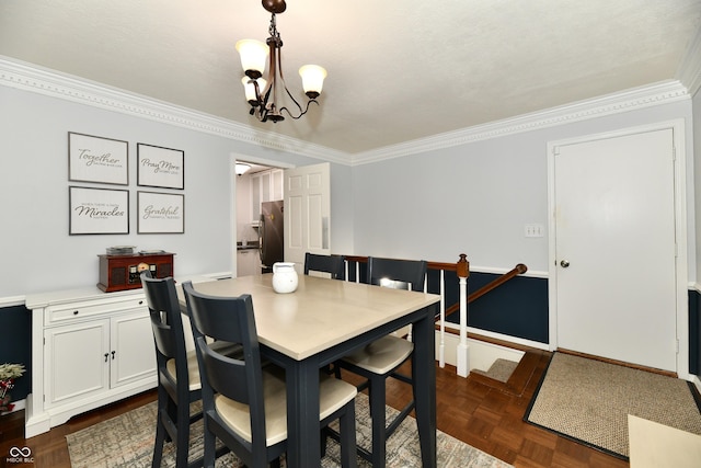 1310 Kings Cove Ct, Indianapolis, IN 46260 - dining room with crown molding, a chandelier, and baseboards