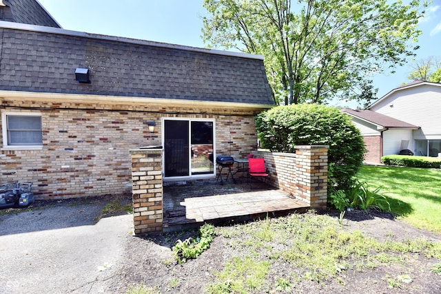 1310 Kings Cove Ct, Indianapolis, IN 46260 - rear view of house with a shingled roof and brick siding