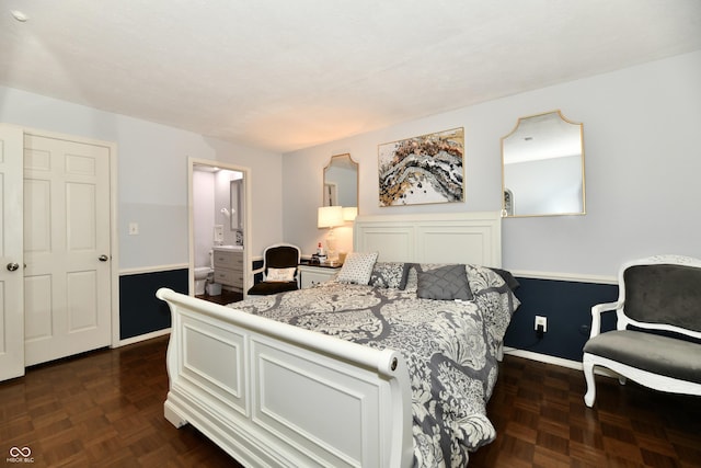 1310 Kings Cove Ct, Indianapolis, IN 46260 - bedroom with baseboards and connected bathroom