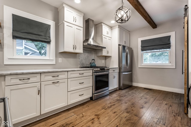5015 N Park Ave, Indianapolis, IN 46205 - kitchen featuring stainless steel appliances, wall chimney exhaust hood, wood finished floors, beam ceiling, and backsplash