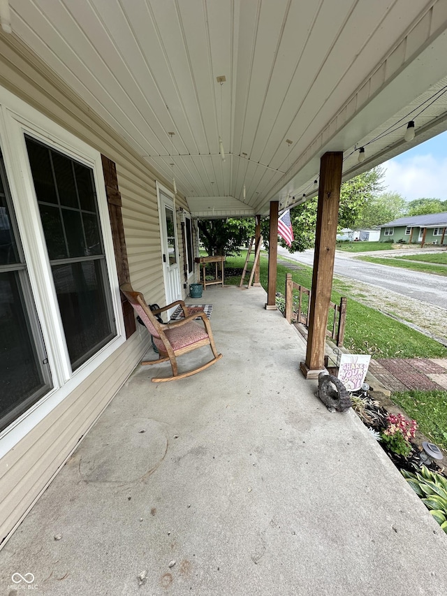 view of patio featuring a porch