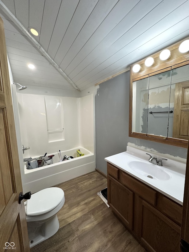 bathroom with wooden ceiling, tub / shower combination, vanity, vaulted ceiling, and wood finished floors