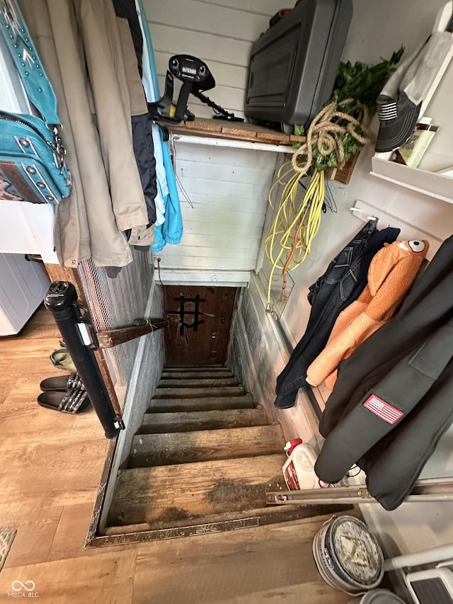 stairway with wood finished floors