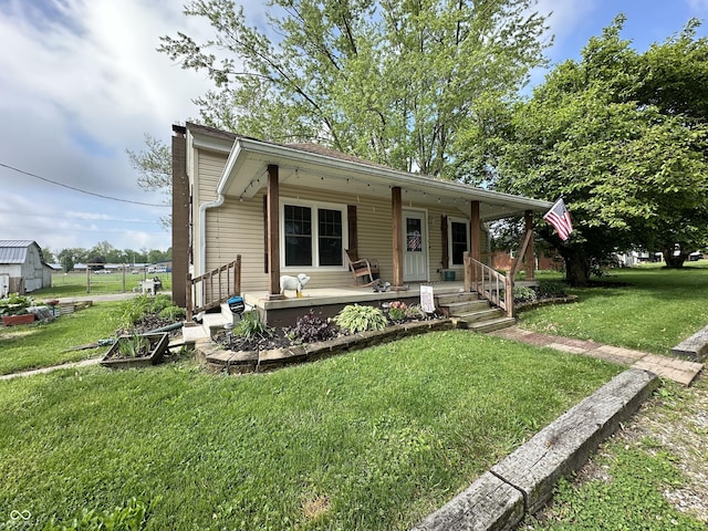 view of front facade with covered porch and a front lawn