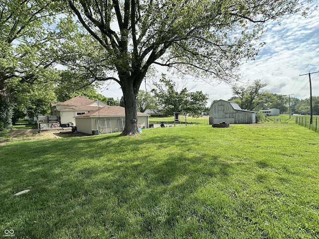 view of yard with a barn and an outdoor structure