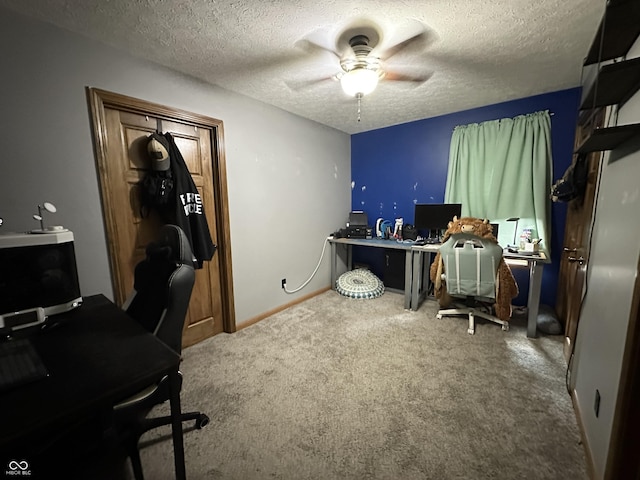 office with ceiling fan, carpet floors, and a textured ceiling