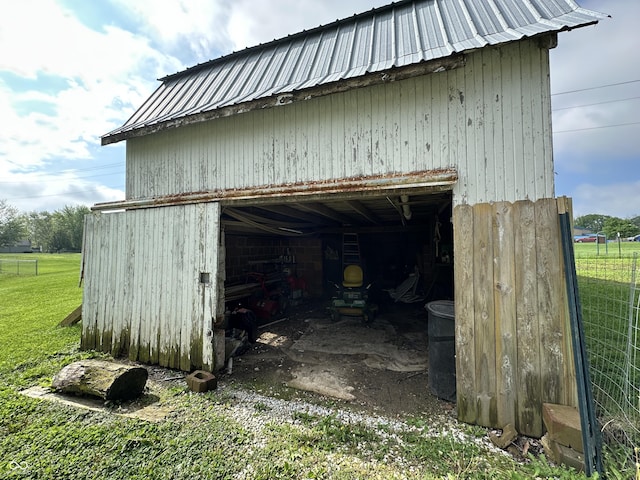 view of outbuilding with a garage and an outbuilding