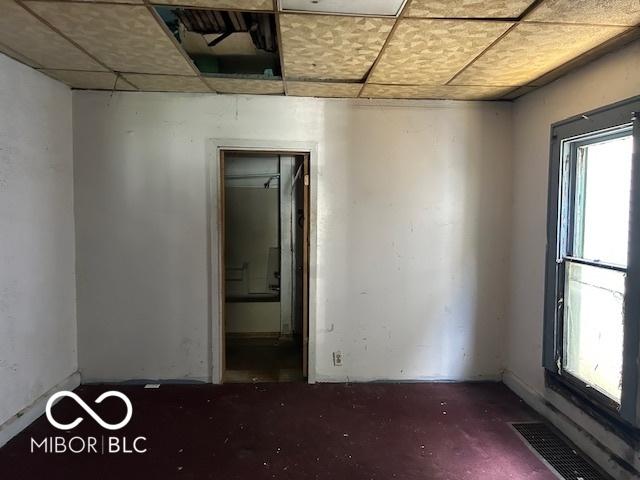 811 W 25th St, Indianapolis, IN 46208 - empty room with a paneled ceiling