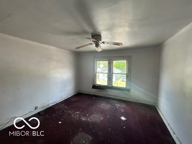 811 W 25th St, Indianapolis, IN 46208 - spare room with a ceiling fan and baseboards
