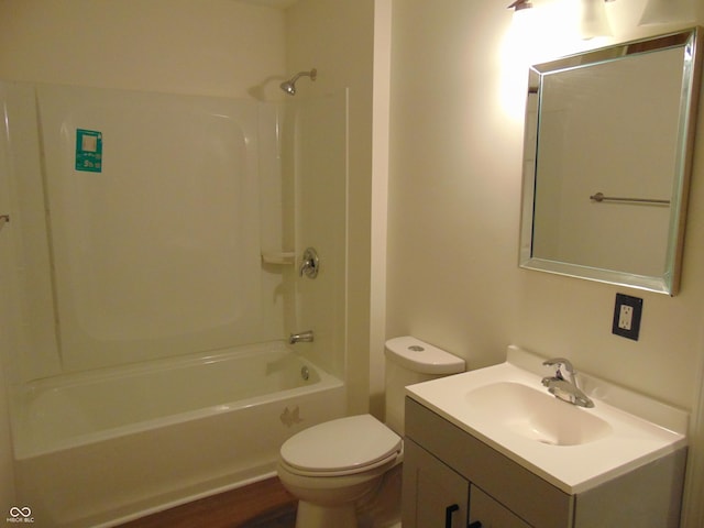 bathroom with toilet, vanity, and bathtub / shower combination