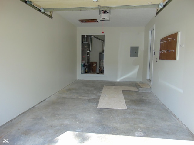 garage with gas water heater, electric panel, a garage door opener, and heating unit
