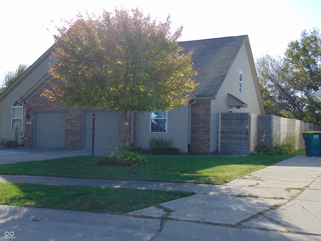 view of front of house with brick siding, driveway, and an attached garage