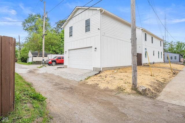 1825 E Maryland St, Indianapolis, IN 46201 - view of home's exterior with an attached garage and dirt driveway