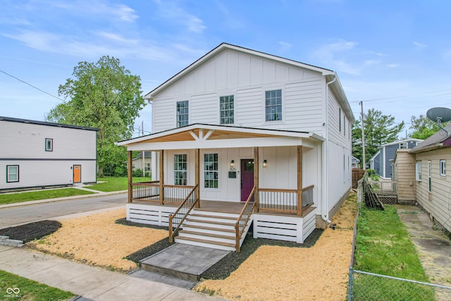 1825 E Maryland St, Indianapolis, IN 46201 - view of front of house featuring board and batten siding and a porch