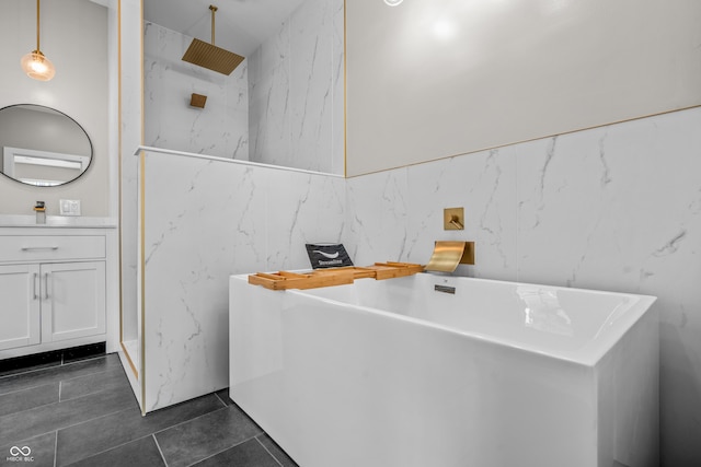 1825 E Maryland St, Indianapolis, IN 46201 - full bath with a soaking tub, tile walls, vanity, a marble finish shower, and tile patterned flooring