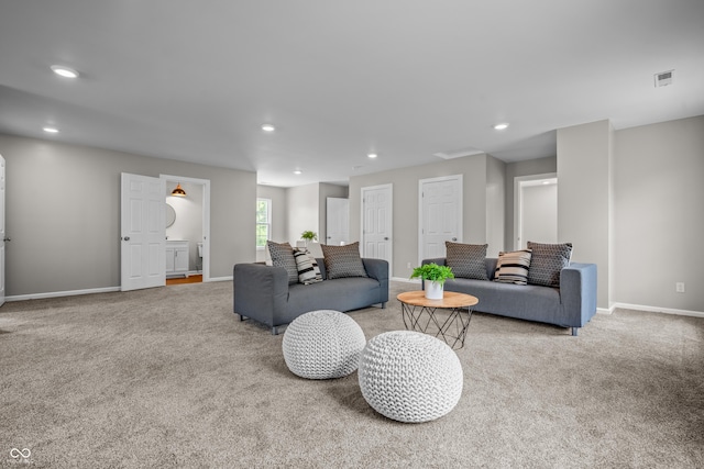 1825 E Maryland St, Indianapolis, IN 46201 - living area featuring carpet flooring, baseboards, and recessed lighting