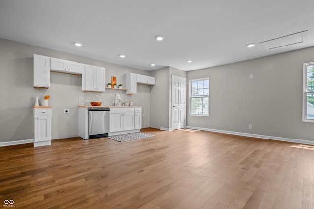 1825 E Maryland St, Indianapolis, IN 46201 - kitchen with dishwasher, healthy amount of natural light, white cabinets, light wood-style flooring, and recessed lighting